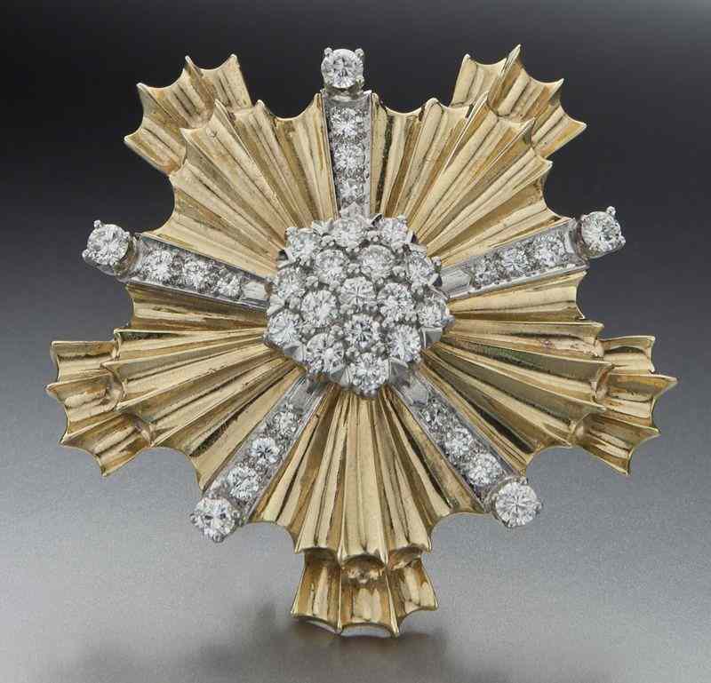 Appraisal: K gold and diamond brooch in a sunburst designfeaturing single