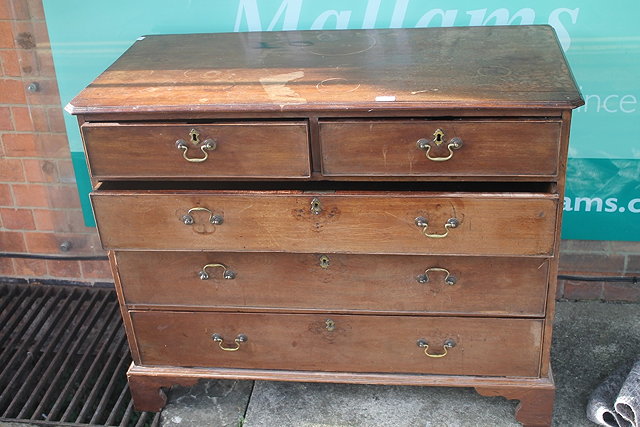 Appraisal: A GEORGE III MAHOGANY STRAIGHT FRONT CHEST of two short