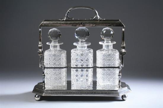 Appraisal: VICTORIAN SILVER-PLATED TANTALUS WITH THREE CUT CRYSTAL BOTTLES John Round