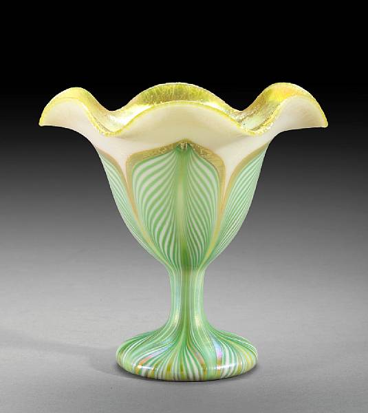 Appraisal: A Quezal decorated iridescent floriform vase s Engraved Quezal height