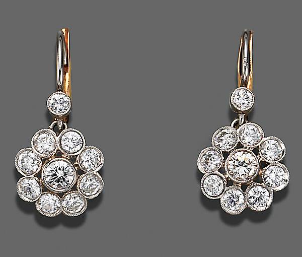 Appraisal: A pair of diamond and platinum earrings estimated total diamond