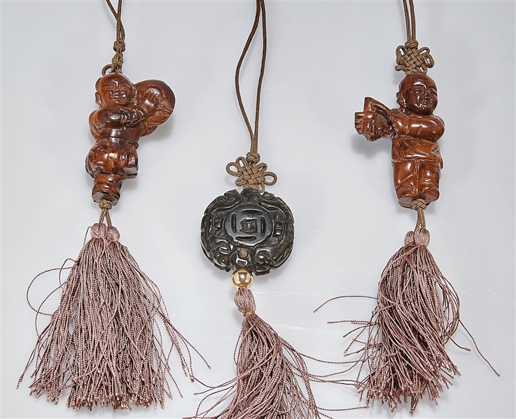 Appraisal: Group of three Chinese carved wood toggles