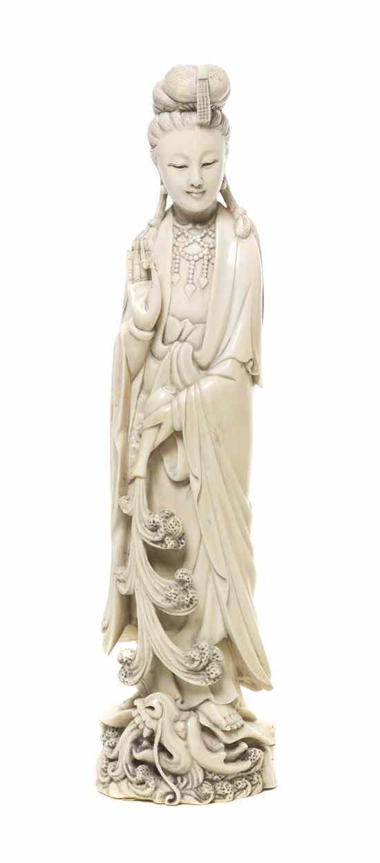 Appraisal: A Chinese Carved Ivory Figure of Guanyin the goddess of