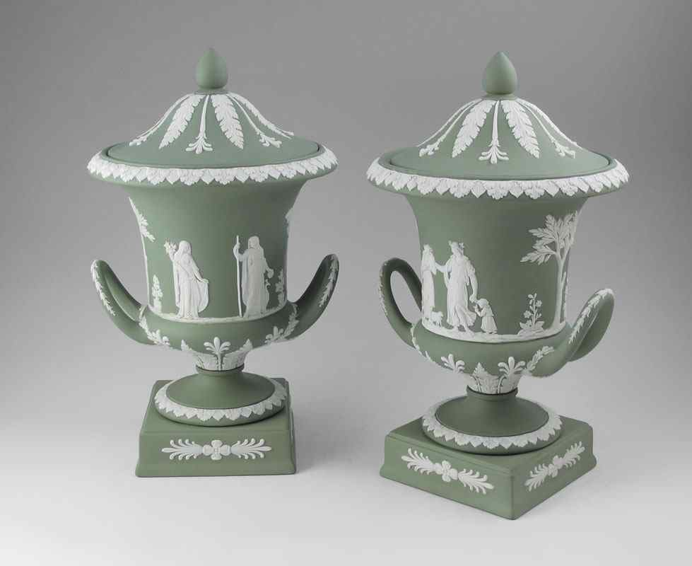 Appraisal: PAIR OF WEDGWOOD GREEN JASPERWARE COVERED URNS Impressed marks ''Wedgwood