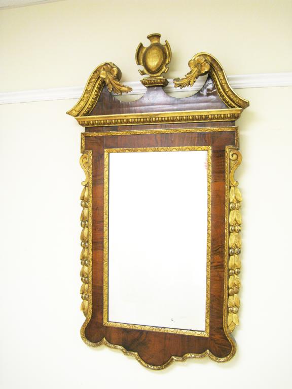 Appraisal: A Georgian walnut and parcel gilt Wall Mirror in the