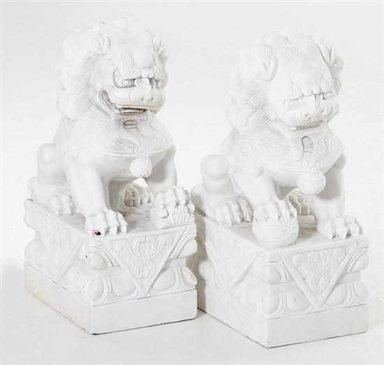 Appraisal: Pair carved stone Foo lions white stone carved in typical