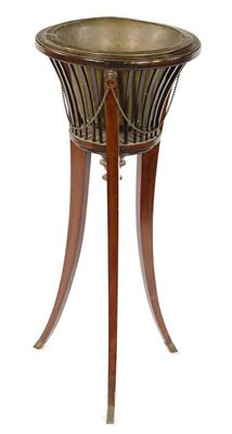 Appraisal: A mahogany jardiniere stand with a brass liner in cm