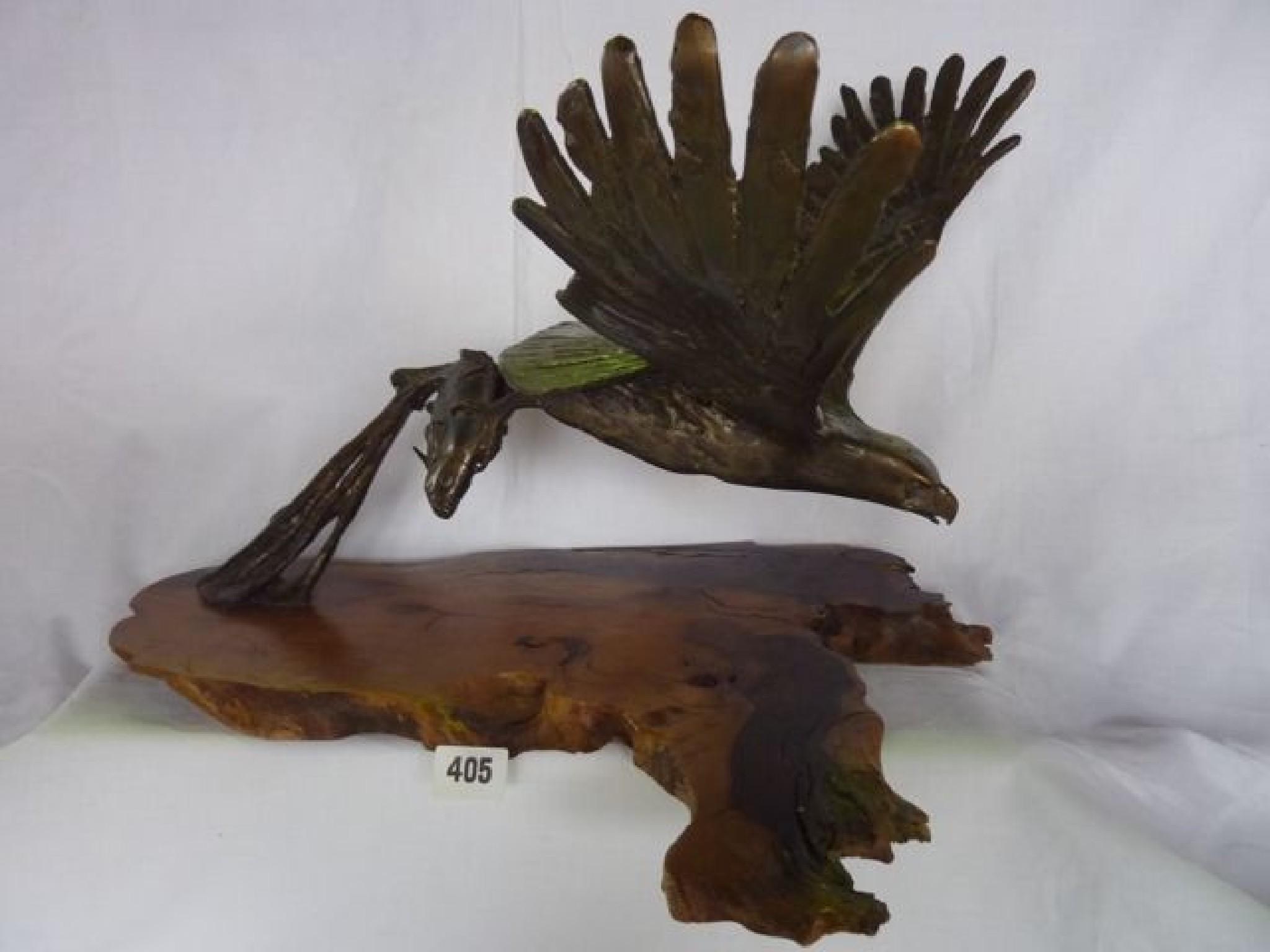 Appraisal: A contemporary bronze figure of fish eagle and catch leaving