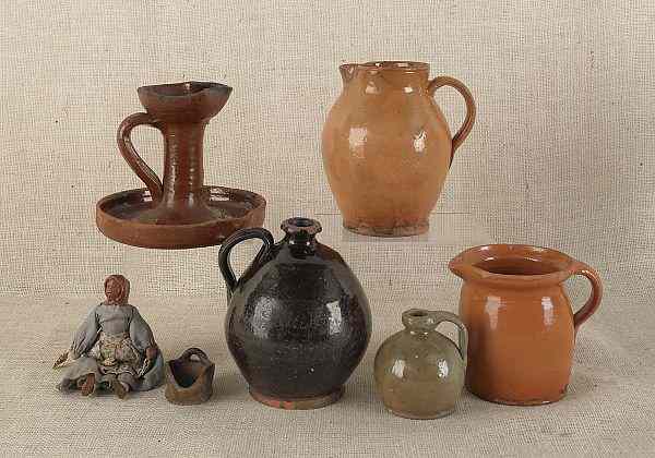 Appraisal: Collection of redware th c to include two fat lamps