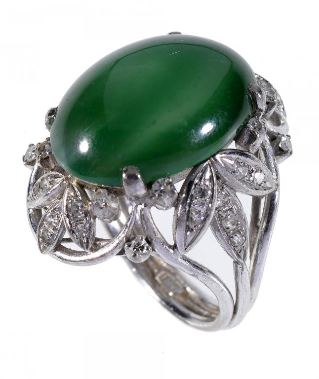 Appraisal: A DIAMOND AND JADE RING the cabochon surrounded by diamond