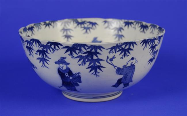 Appraisal: JAPANESE BLUE AND WHITE PORCELAIN BOWL decorated with figures in