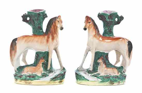 Appraisal: A Pair of Staffordshire Figural Spill Vases each depicting a