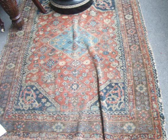 Appraisal: A Guasghai rug South West Persia the madder field with