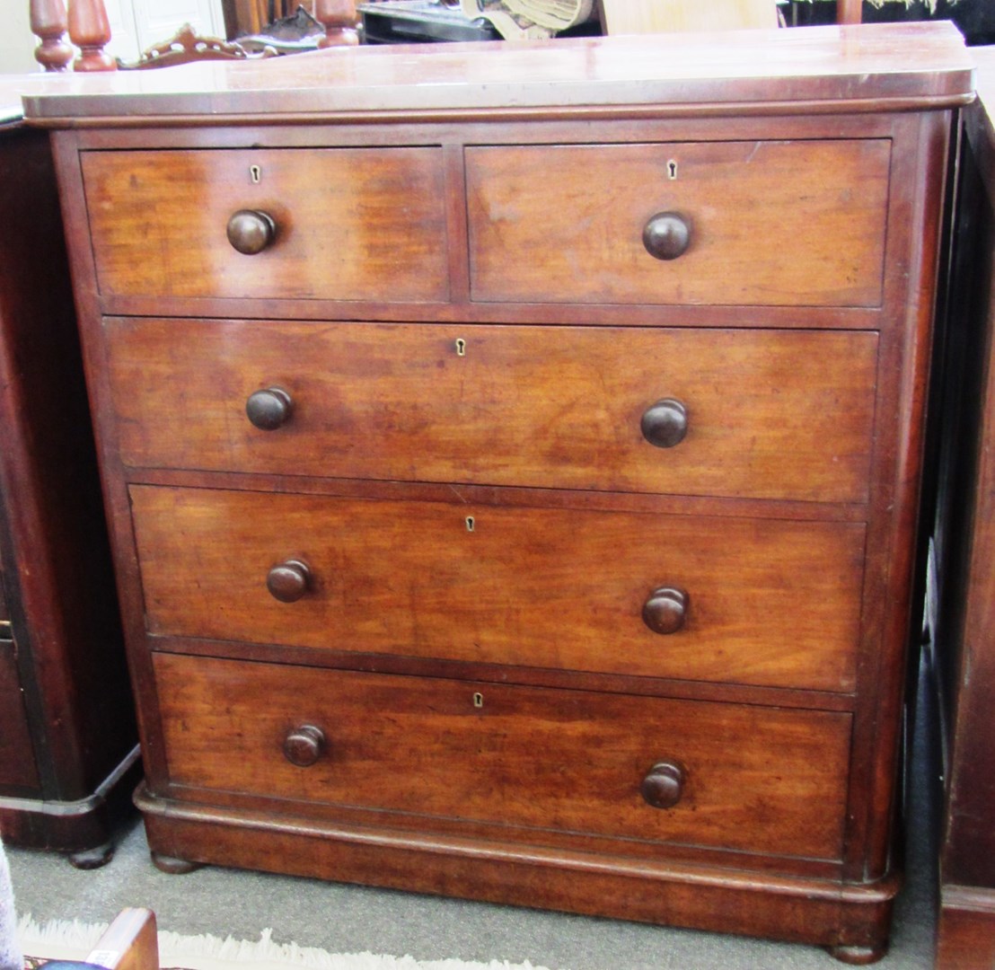 Appraisal: A Victorian mahogany chest of two short and three long