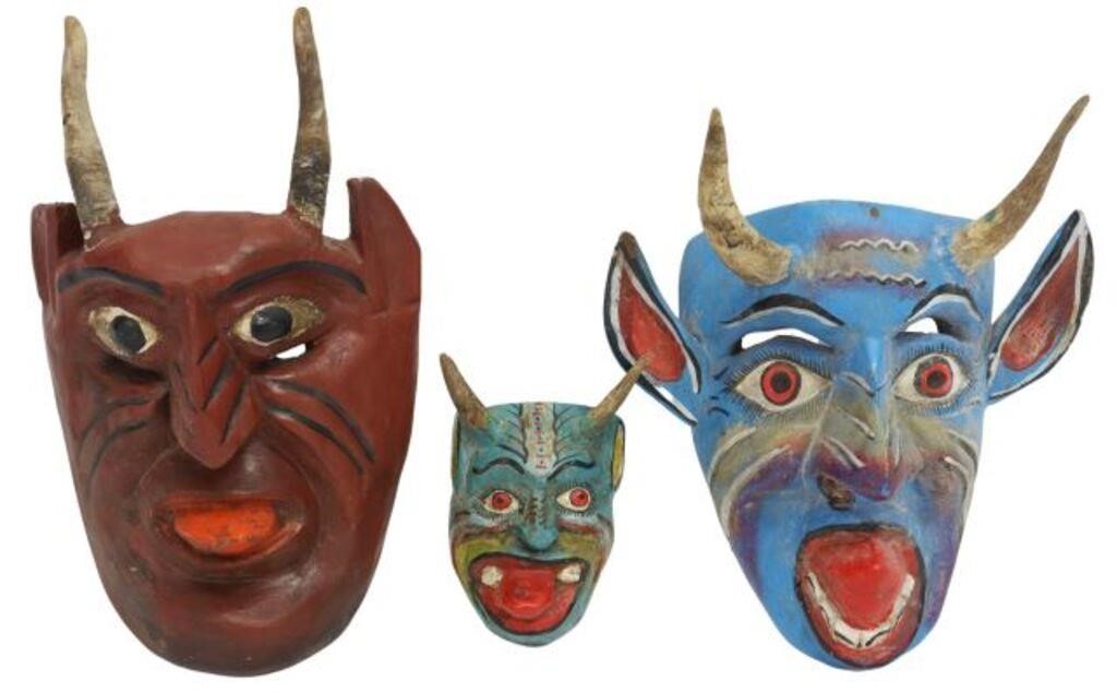 Appraisal: lot of Folk art polychromed carved wood masks Mexico each