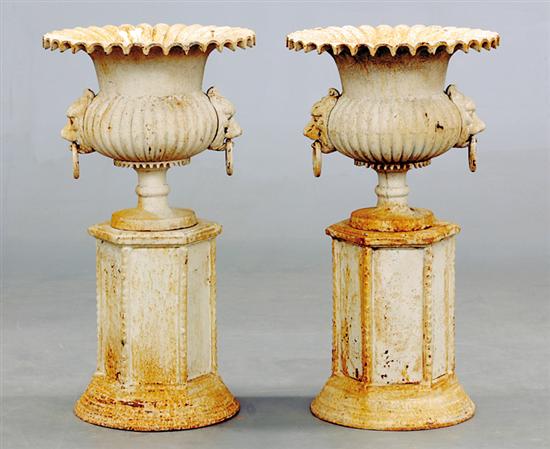 Appraisal: Pair cast-iron garden urns flared basin with lobed body and