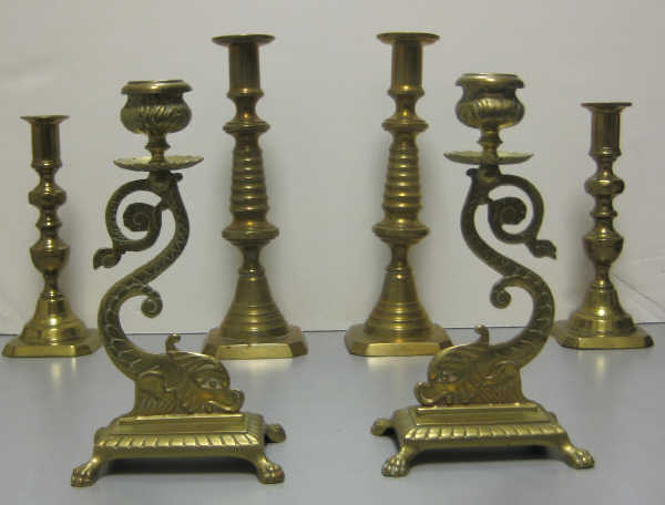 Appraisal: GROUP OF AMERICAN BRASS CANDLESTICKS Three pairs including dolphin form