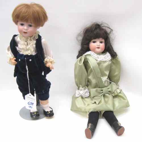 Appraisal: TWO GERMAN ARMAND MARSEILLE DOLLS a bisque socket head boy