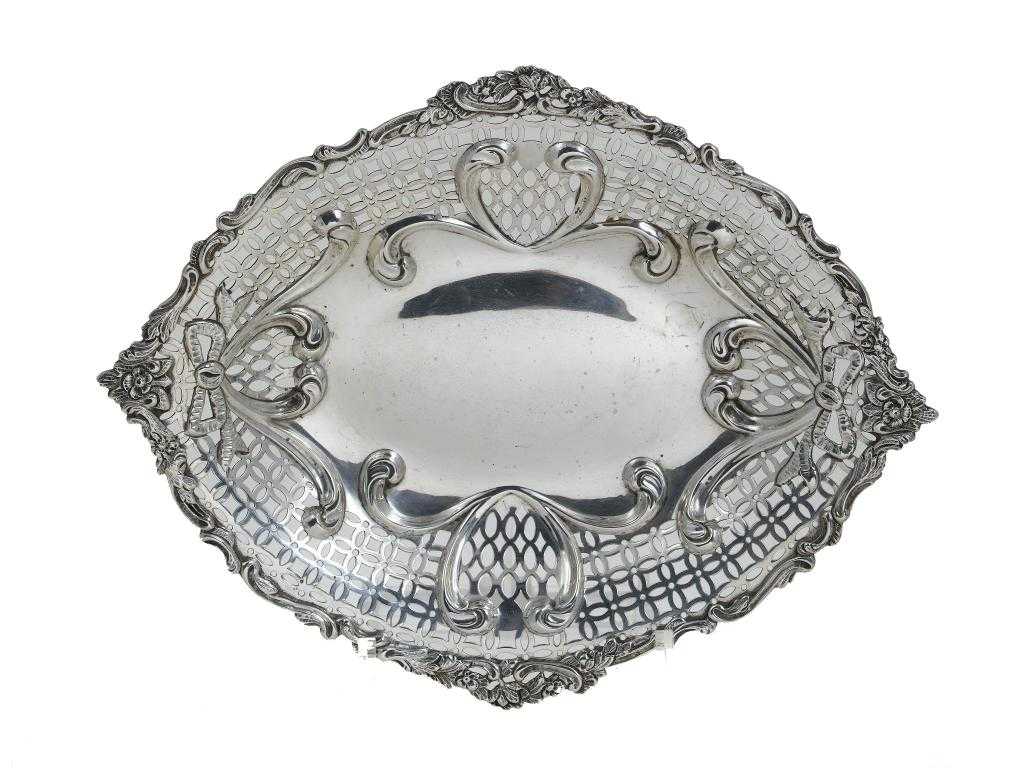 Appraisal: A VICTORIAN FRUIT DISH the diaper pierced border embossed with