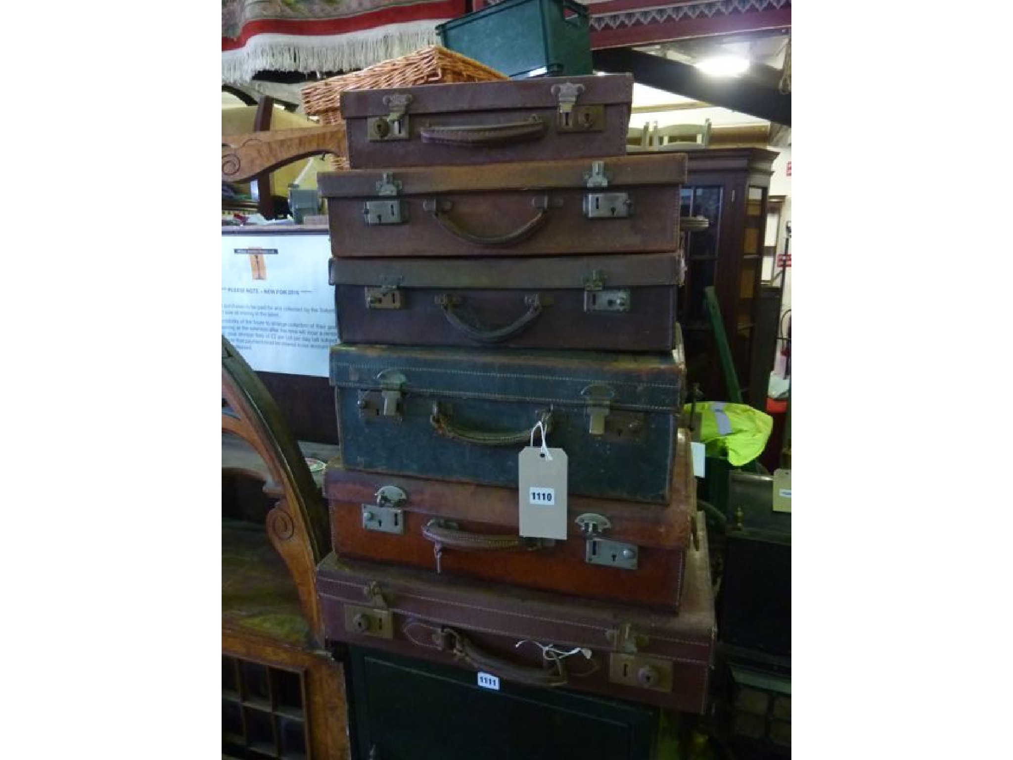 Appraisal: A tower of six small vintage suitcases in leather