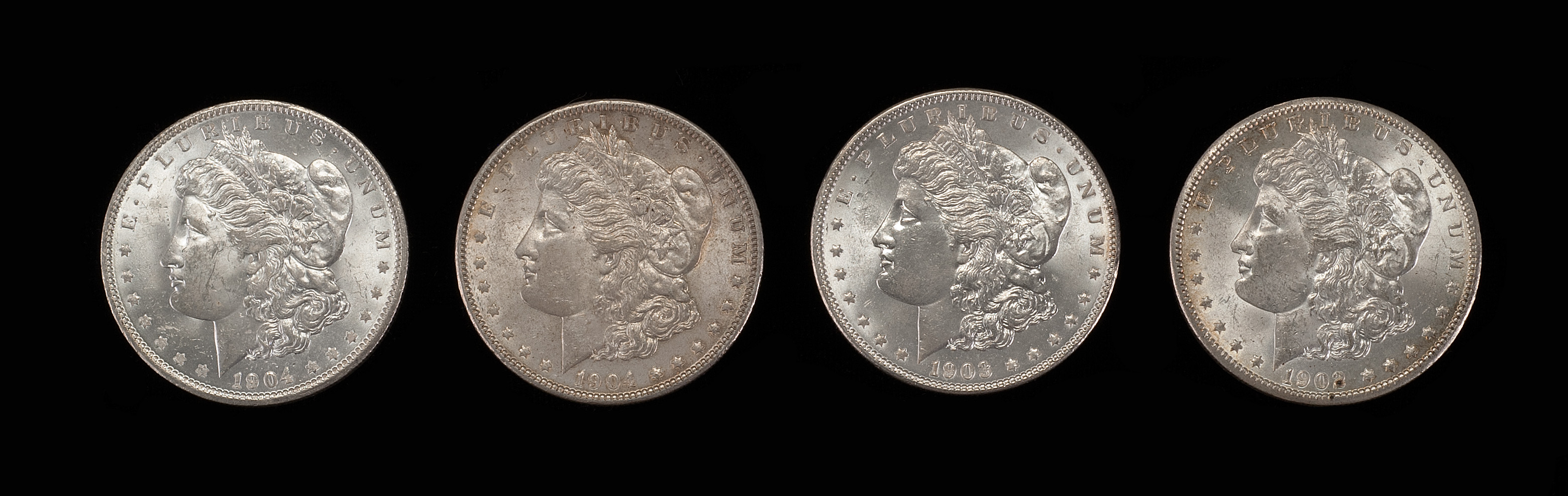 Appraisal: FOUR U S MORGAN SILVER DOLLARS -O and -O Some