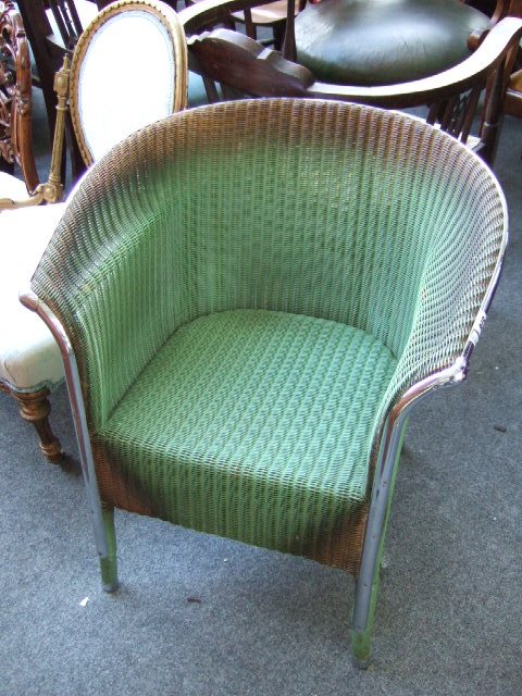 Appraisal: A Lloyd Loom 'Lusty' wicker armchair with chrome mounts bears