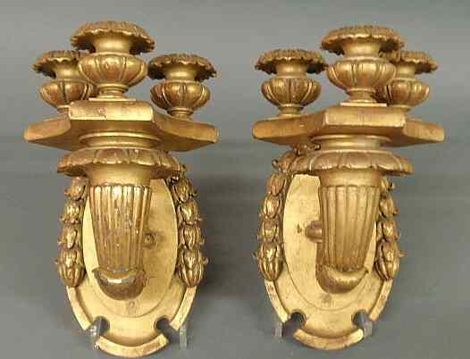 Appraisal: Pair of ornately carved sconces with gilt decoration and bellflower