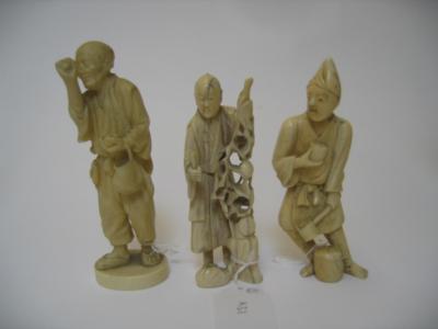 Appraisal: A GROUP OF THREE SMALL IVORY FIGURES c carved as