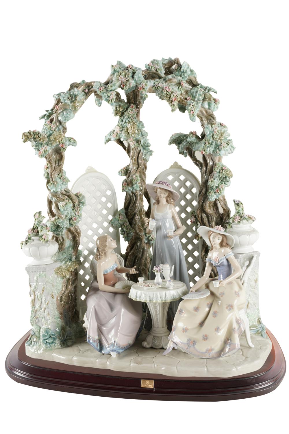 Appraisal: LLADRO TEA IN THE GARDEN PORCELAIN FIGURAL GROUPwith Lladro plaque