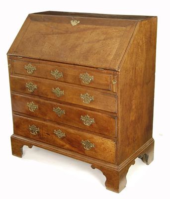 Appraisal: A George III mahogany bureau the fall enclosing a fitted