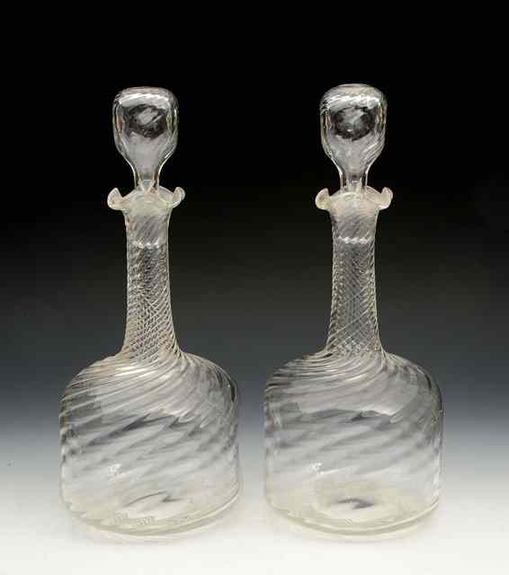 Appraisal: A pair of probably Stourbridge or Walsh decanters and stoppers