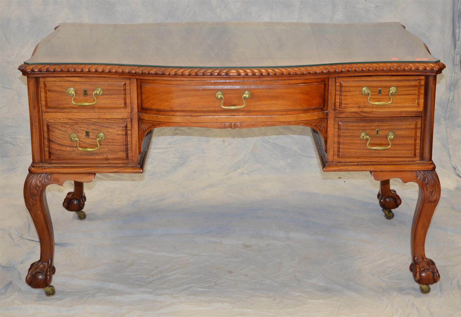 Appraisal: Carved mahogany Centennial Chippendale style faux partner's desk serpentine shaped