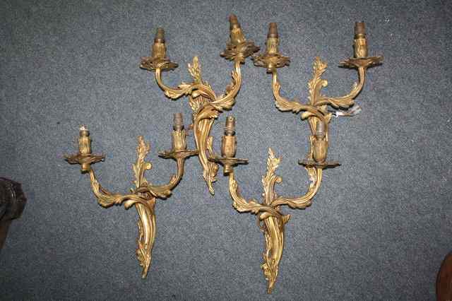 Appraisal: FOUR EARLY TH CENTURY GILT BRASS TWO BRANCH WALL LIGHTS