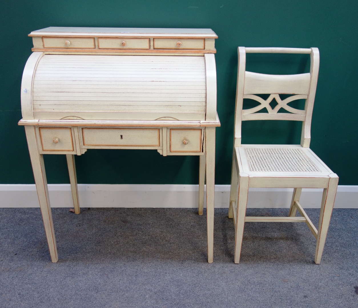 Appraisal: A th century distressed cream painted cylinder bureau with fitted