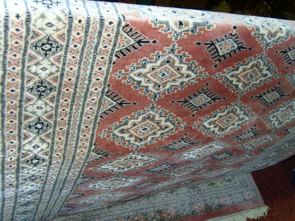 Appraisal: A Persian style carpet with pale brick ground with geometric