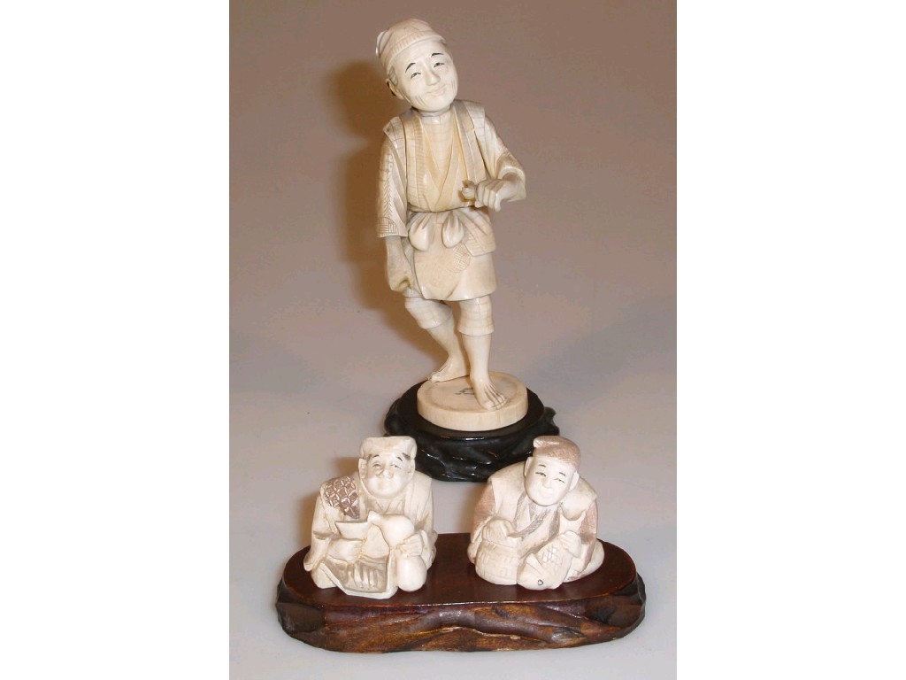 Appraisal: An early thC Japanese ivory sectional figure of a fisherman