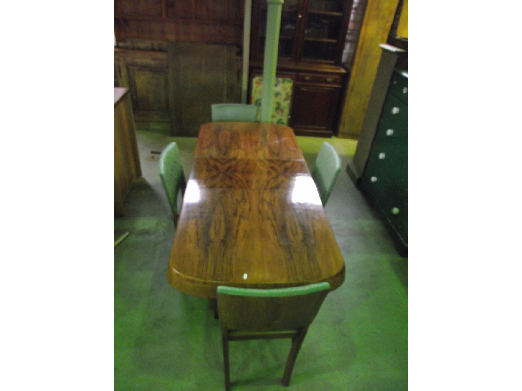 Appraisal: An Art Deco style walnut veneered dining room suite comprising