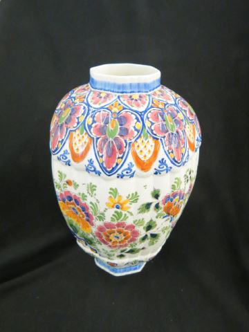 Appraisal: Delft Pottery Vase handpainted peacock foliage ribbed body signed excellent