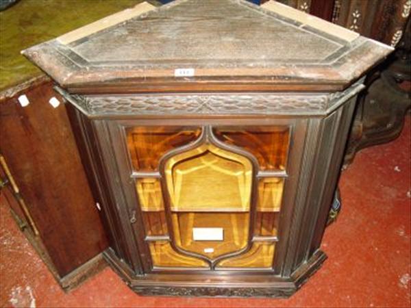 Appraisal: A carved hanging corner cupboard