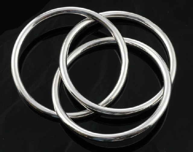 Appraisal: A sterling silver bangle Comprising three interlinking hoop bangles