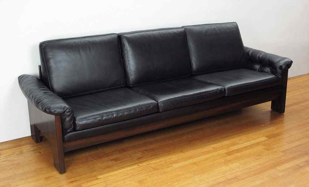 Appraisal: MILO BAUGHMAN ROSEWOOD AND BLACK LEATHER SOFA Rosewood back sides