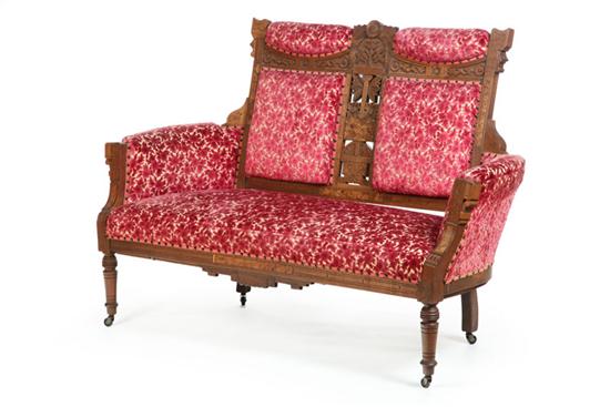 Appraisal: SETTEE Walnut carved and incised settee with crocheted floral upholstery