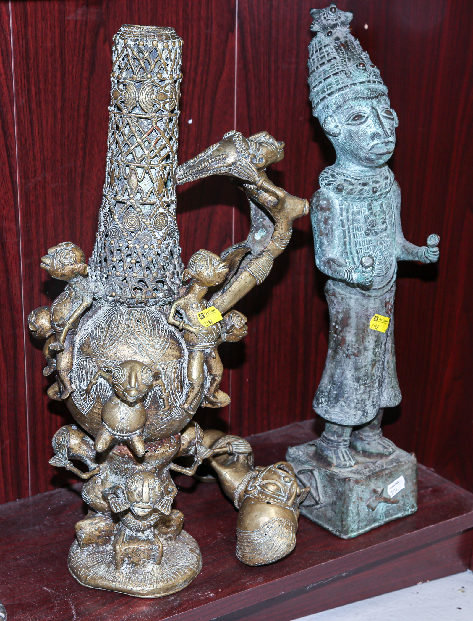 Appraisal: TWO AFRICAN BRASS SCULPTURES Includes a figural vase from Cameroon