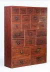 Appraisal: CUPBOARD - New England red painted pine twenty-three graduated drawer