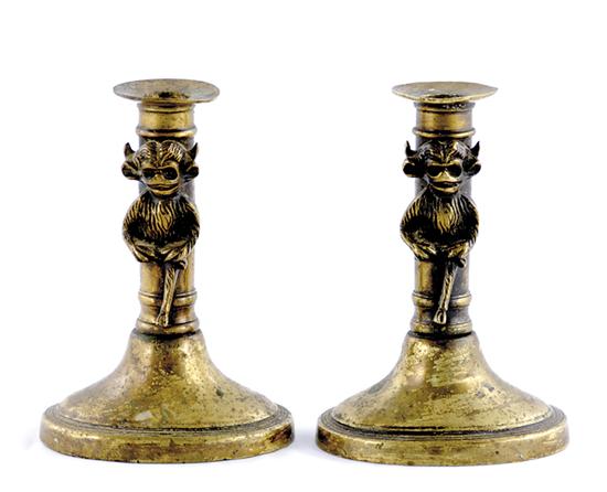 Appraisal: Pair Continental push-up candlesticks column stem with applied devilish figures