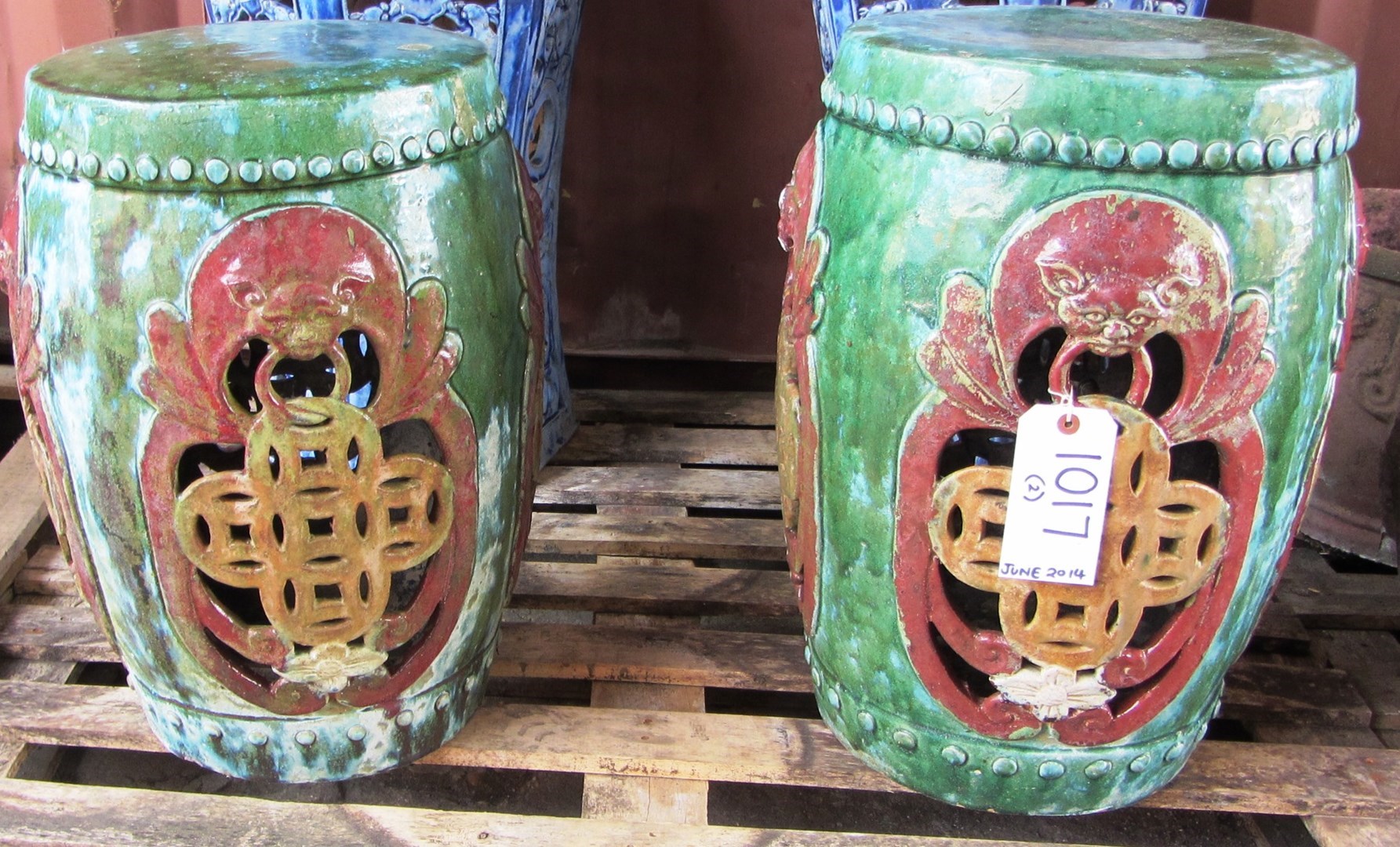 Appraisal: A pair of multi coloured glazed cylindrical terracotta garden seats