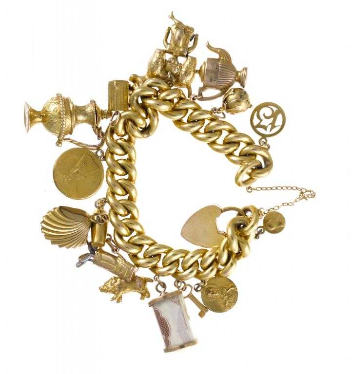 Appraisal: A GOLD CHARM BRACELET the curb bracelet and padlock marked