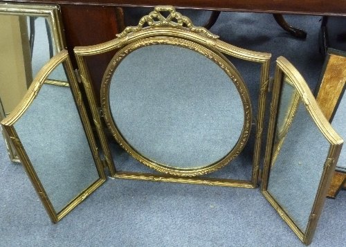 Appraisal: A triple-frame dressing mirror with central oval plate and two