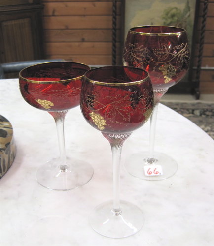 Appraisal: TWENTY-EIGHT RED AND CLEAR GLASS GOBLETS in three sets red