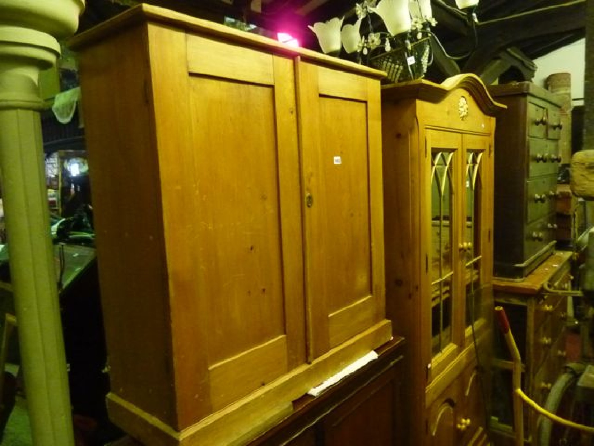 Appraisal: A th century stripped pine side cupboard enclosed by a